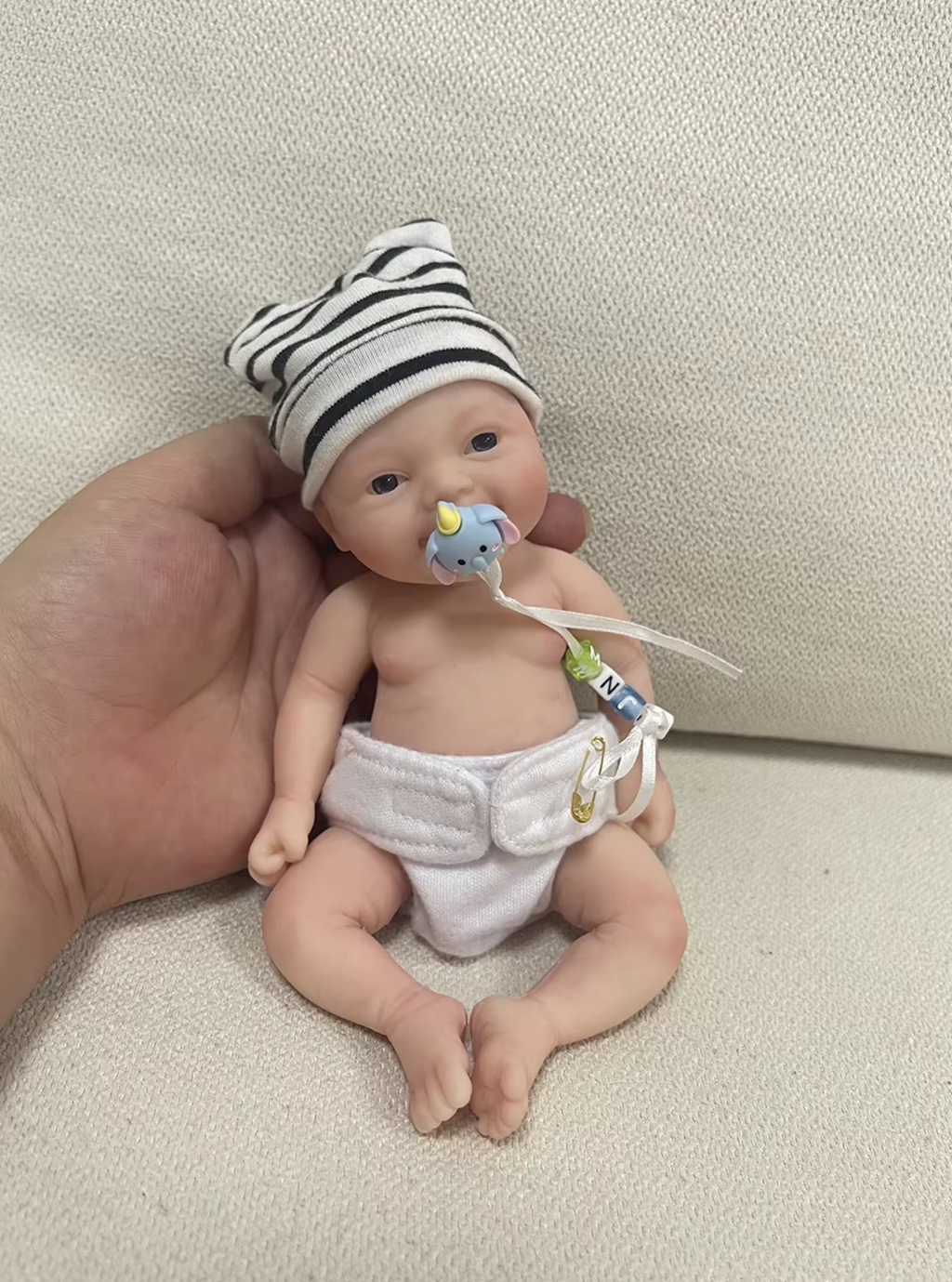 Realistic Palm Sized Mini Reborn Doll Noah with Smiling Silicone Baby